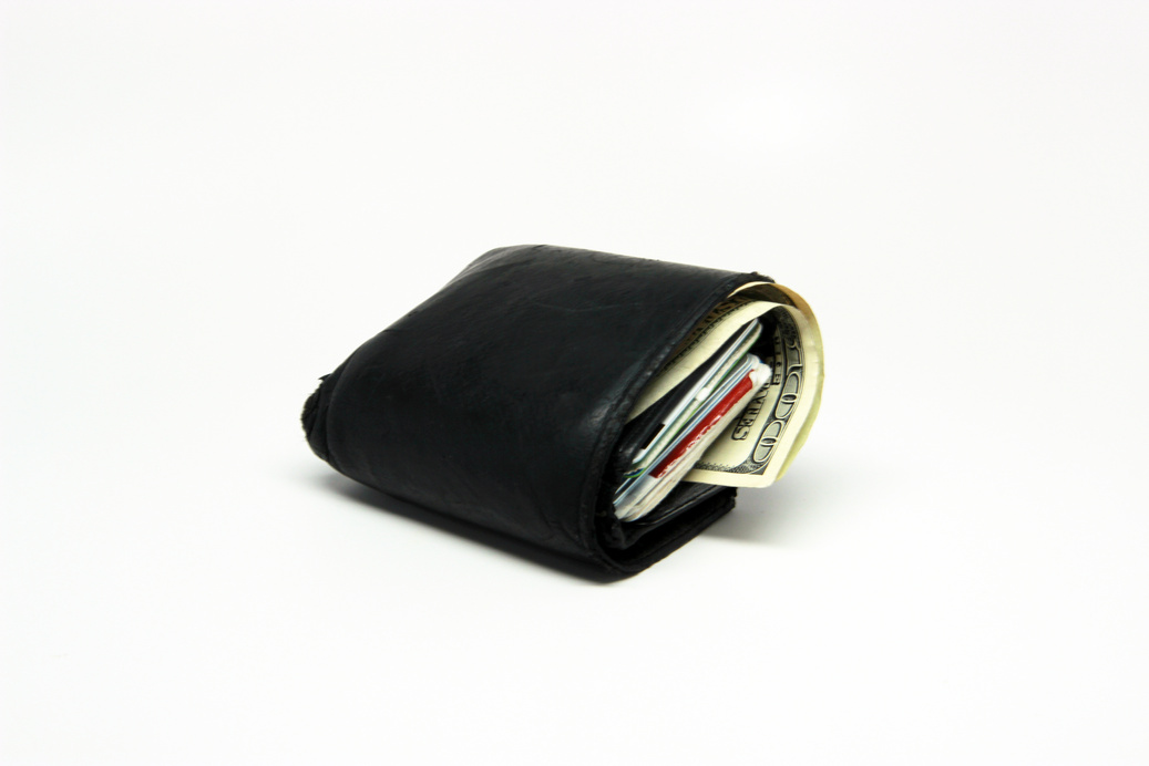 Fat Wallet with Money on White Background